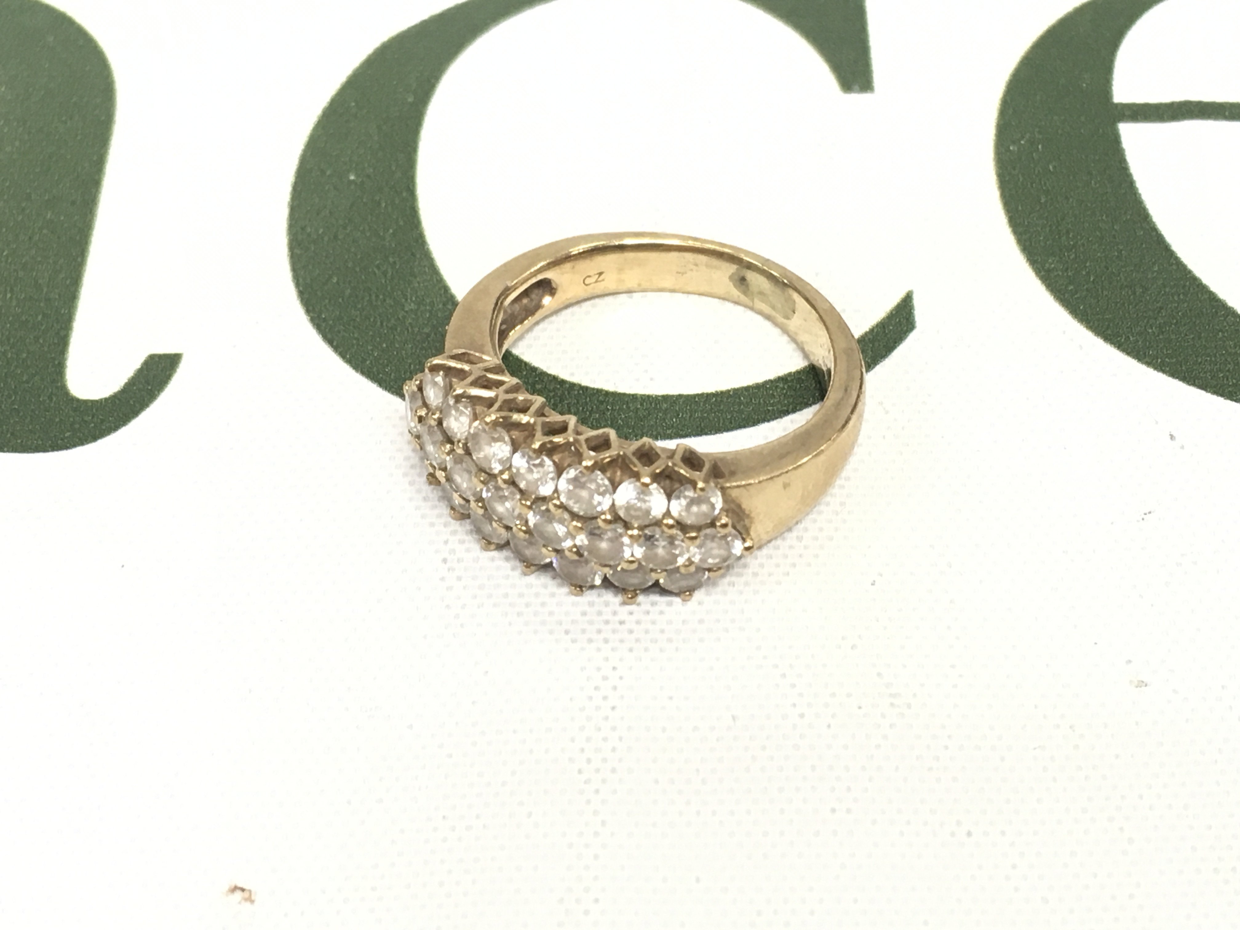 A 9ct gold ring set with czs. Approx weight 5.41grams, size N.