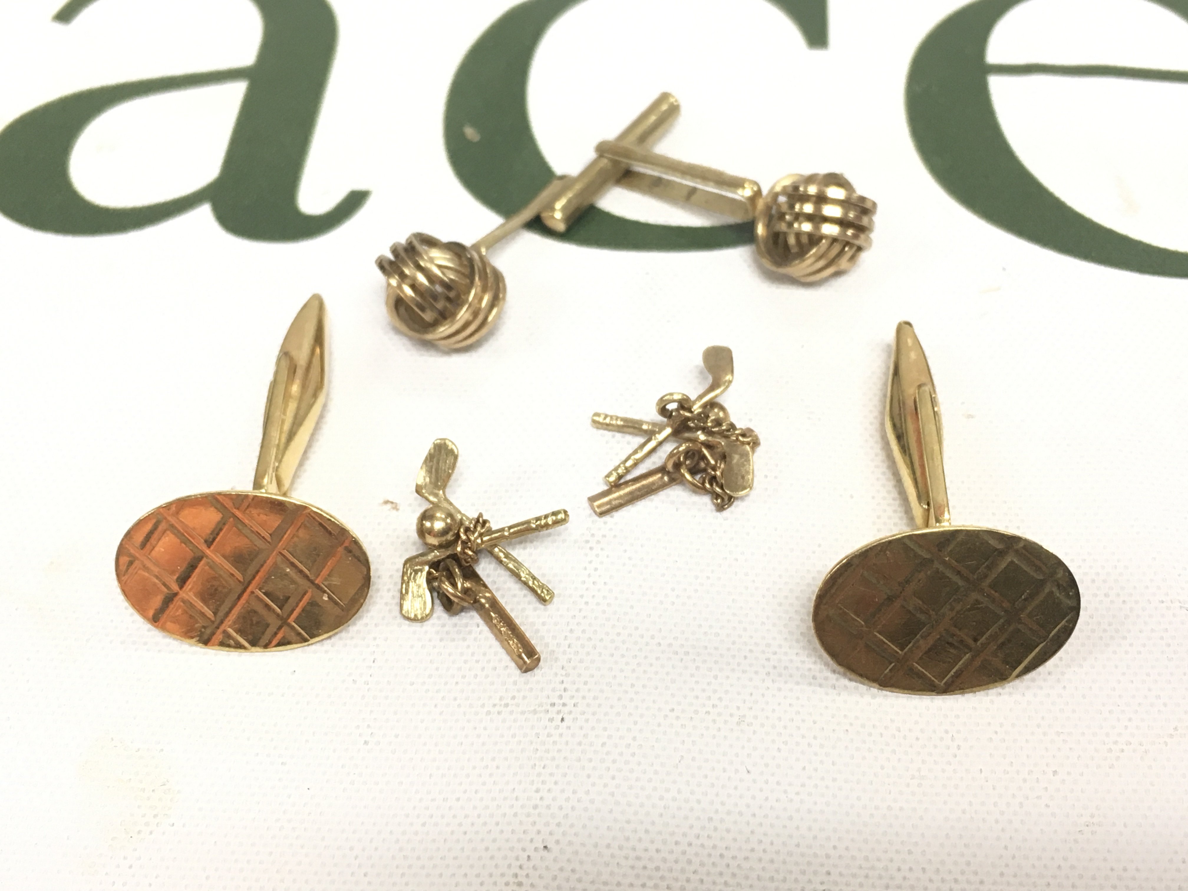 A pair of 18ct gold crosshatch patterned cufflinks and two pairs of 9ct gold cufflinks, Approx weight of 18ct 5.68 grams, Approx weight of 9ct 3.98 grams.