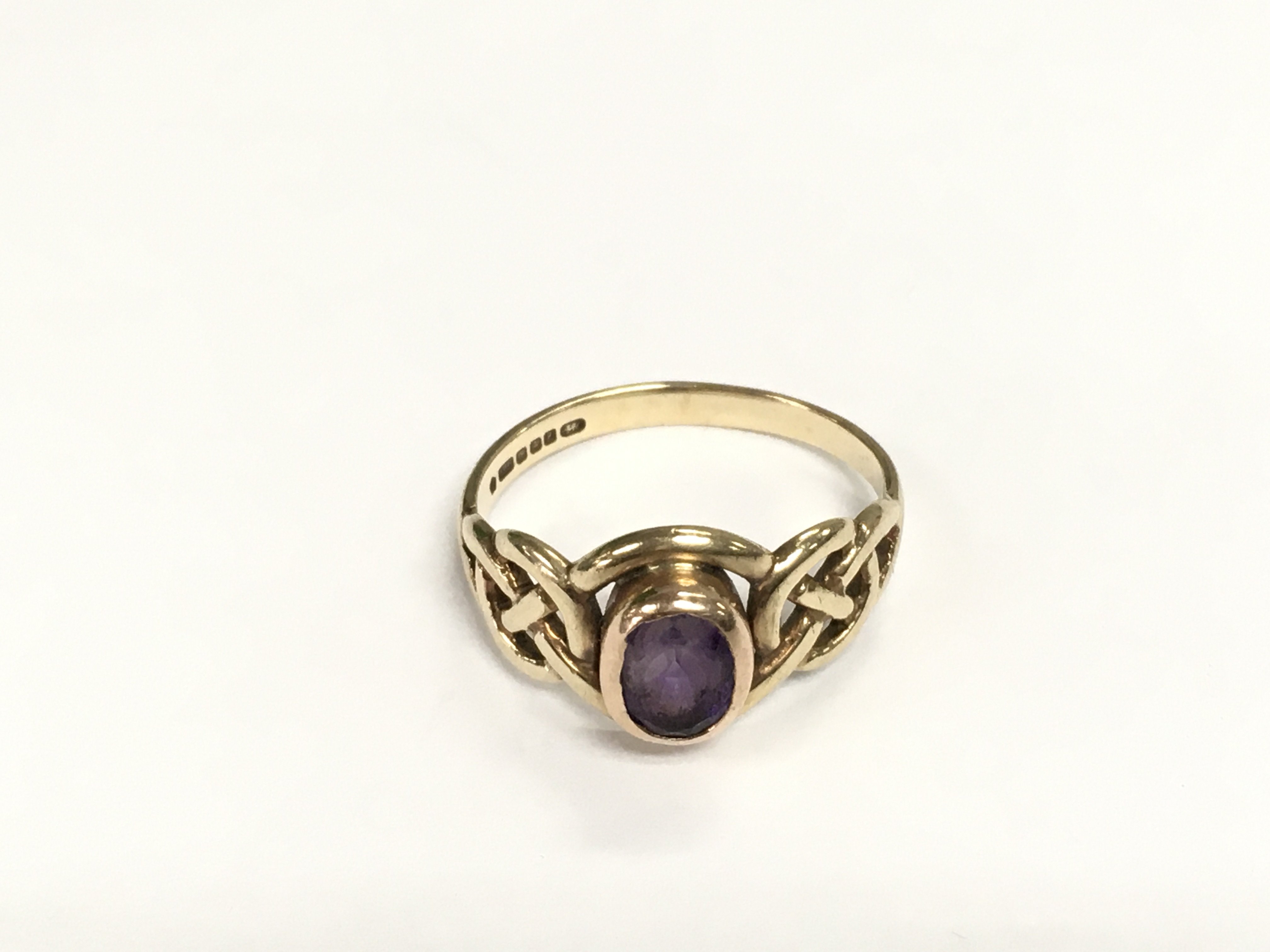 A 9ct welsh gold ring set with a central amethyst, approx 2.7g and approx size M-N. Shipping category A.