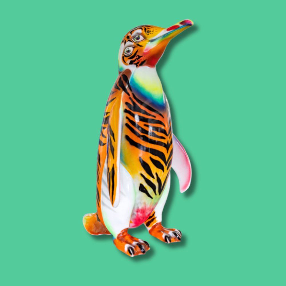 Terrence The Tiger Penguin - Sponsor: Unitruc Limited / Artist: Scott Irving / There is a tiger theme that runs through Scott's work and Terrence the Tiger Penguin is representative of that. Terrence can be described as a mystical, hybrid creature appearing in its surrealist form. Scott is a spray-can specialist and practising street artist who has worked with his local community for over 20 years. Also a Youth Worker and Art Teacher, Scott is widely recognised for his contributions to the graffiti scene and for playing a part in the rising popularity of street art as a respected and dynamic art form. - Height 1600mm width 890mm Depth 1090mm weight 30kg