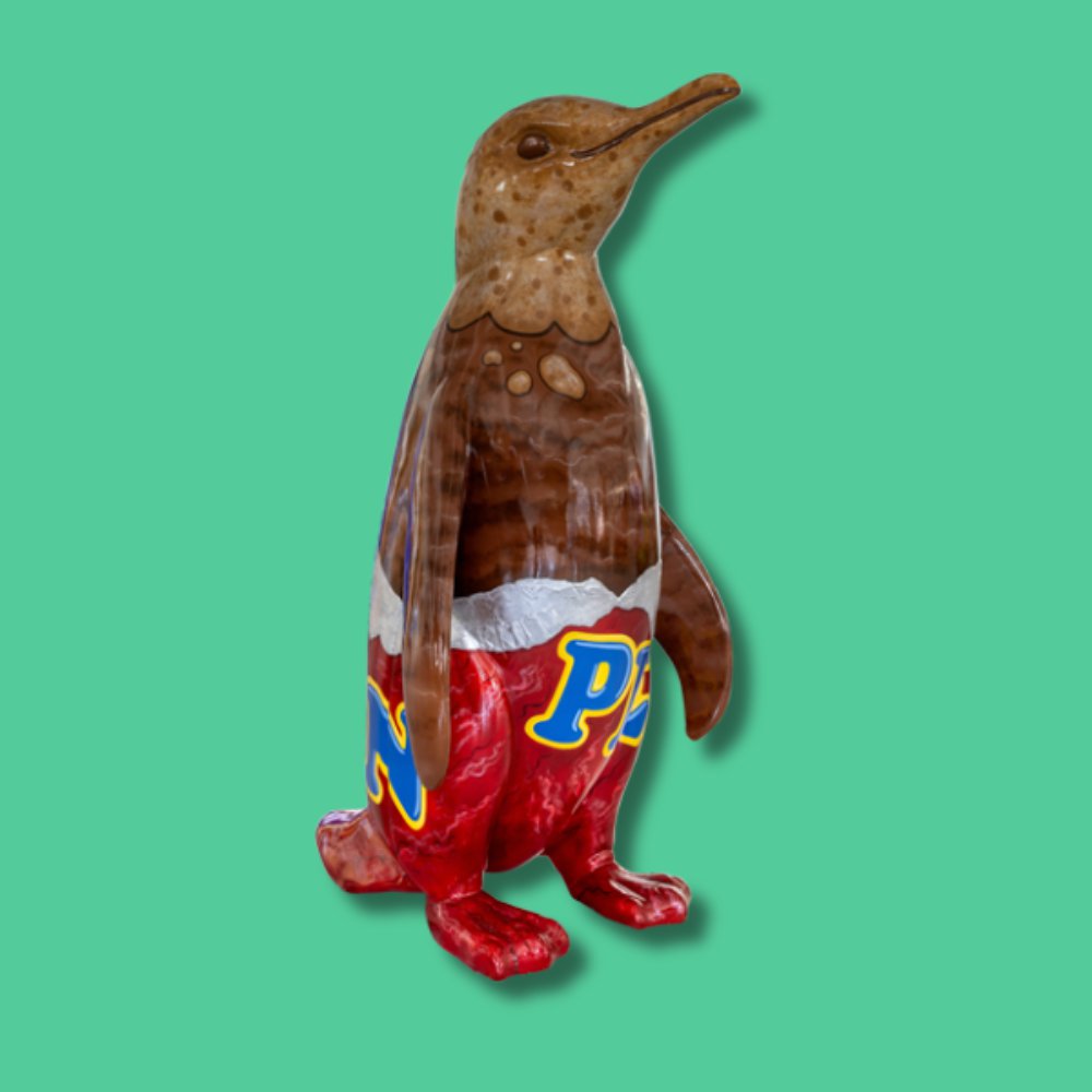 Penguin - Sponsor: Franklin James Credit Management Limited / Artist: Donna Newman / This fun and playful design sees the artist transform the sculpture into a giant chocolate-coated biscuit. The larger-than-life treat looks good enough to eat emerging from its red foil wrapper. It looks like someone has already taken a nibble from this delicious treat. Donna Newman is the artist behind Eden Design Murals. Based in the Midlands, she works with schools to inspire young people by transforming learning environments with vibrant artwork. A fine art graduate from Coventry University, she responds to briefs with creativity and flair, producing original, playful designs across a wide variety of subjects, helping to bring imagination and colour into educational spaces. - Height 1600mm width 890mm Depth 1090mm weight 30kg