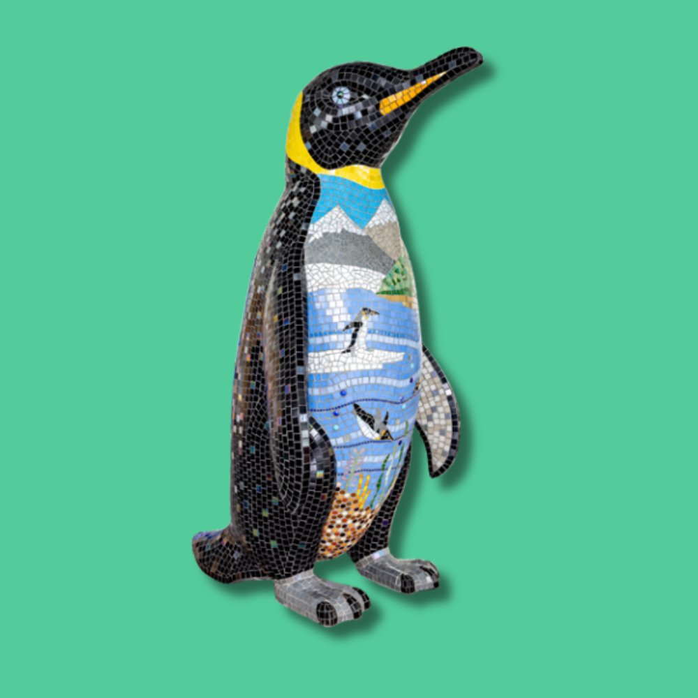 Home Sweet Home - Sponsor: Solopress / Artist: Jen French / This mosaic design shows a scene of King Penguins in their natural habitat. This artwork aims to be thought provoking, to make us stop and think about what we can do to protect their home from climate change. Jen French is a mixed media mosaic artist based in Leigh- on-Sea and a postgraduate of the London School of Mosaic. She works on large-scale commissions while also creating original mosaic art for homes and gardens. Jen teaches workshops from her home studio and at venues including the Essex Wildlife Trust and Oh Happy Creative in Leigh-on-Sea. - Height 1600mm width 890mm Depth 1090mm weight 30kg