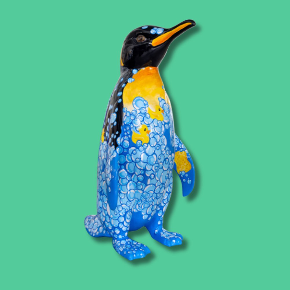Bird Bath - Sponsor: Essex & Suffolk Water / Artist: Ali Elly / Rub-A-Dub-Dub, this penguin is taking a bath. With his soap and sponge he has made so many luxurious bubbles in his bath. Soaking with all his rubber ducks he's in no hurry to do anything. Ali works from her studio on the Northumberland coastline. An environmental artist, she draws constant inspiration from the organic, chaotic patterns of the underwater world. Her illustrations appear in many books and publications, and she enjoys taking on a variety of projects and commissions with organisations around the world. - Height 1600mm width 890mm Depth 1090mm weight 30kg