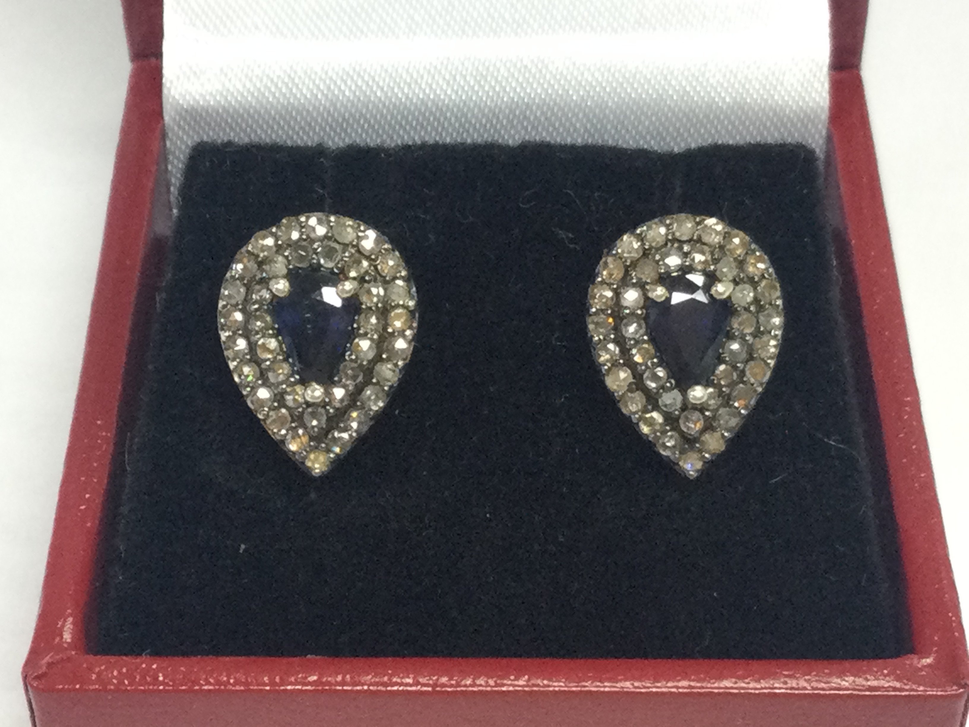 Pair of silver gilt pear drop shaped stud earrings set with pear shaped sapphires and diamond double halos, boxed . Sapphires 0.98ct , rose cut diamonds 0.63ct