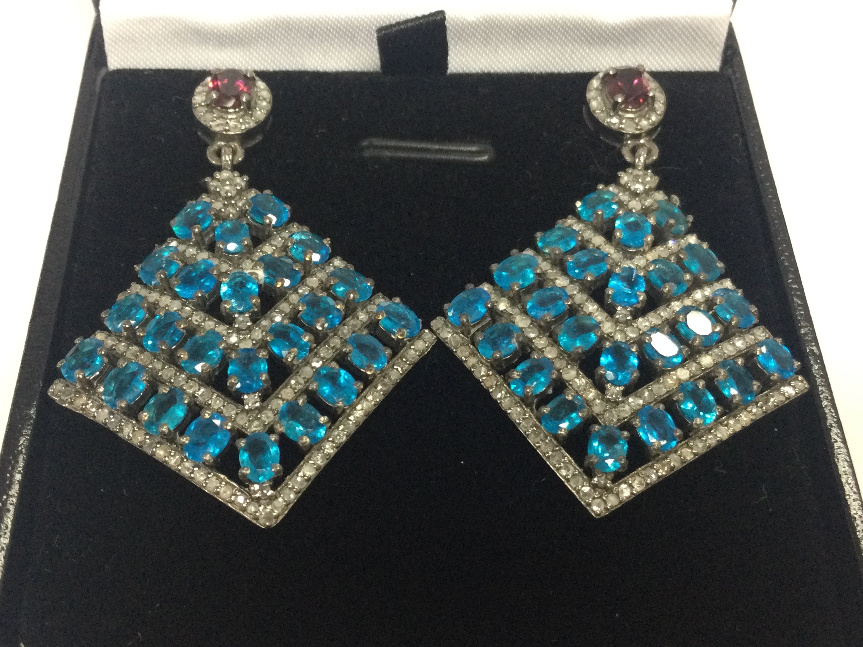 A pair of silver flared drop earrings set with oval apatites , round garnets and diamonds , boxed. Apatites 5.00ct approx . Garnet 0.45ct approx. Diamonds 1.00ct approx 
