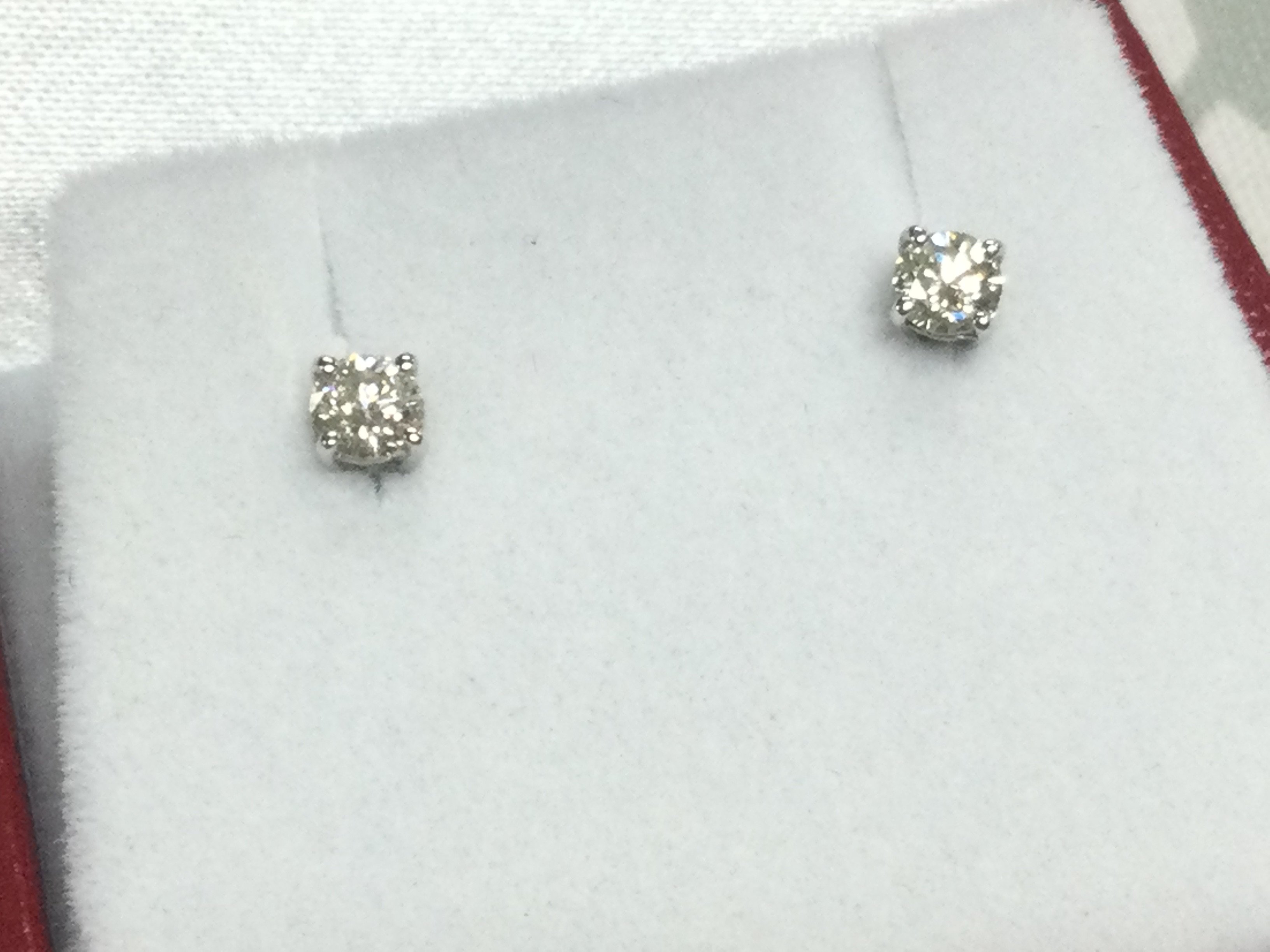 Pair of 18ct white gold 4 claw set solitaire diamond studs, boxed. RBC diamonds 0.30ct