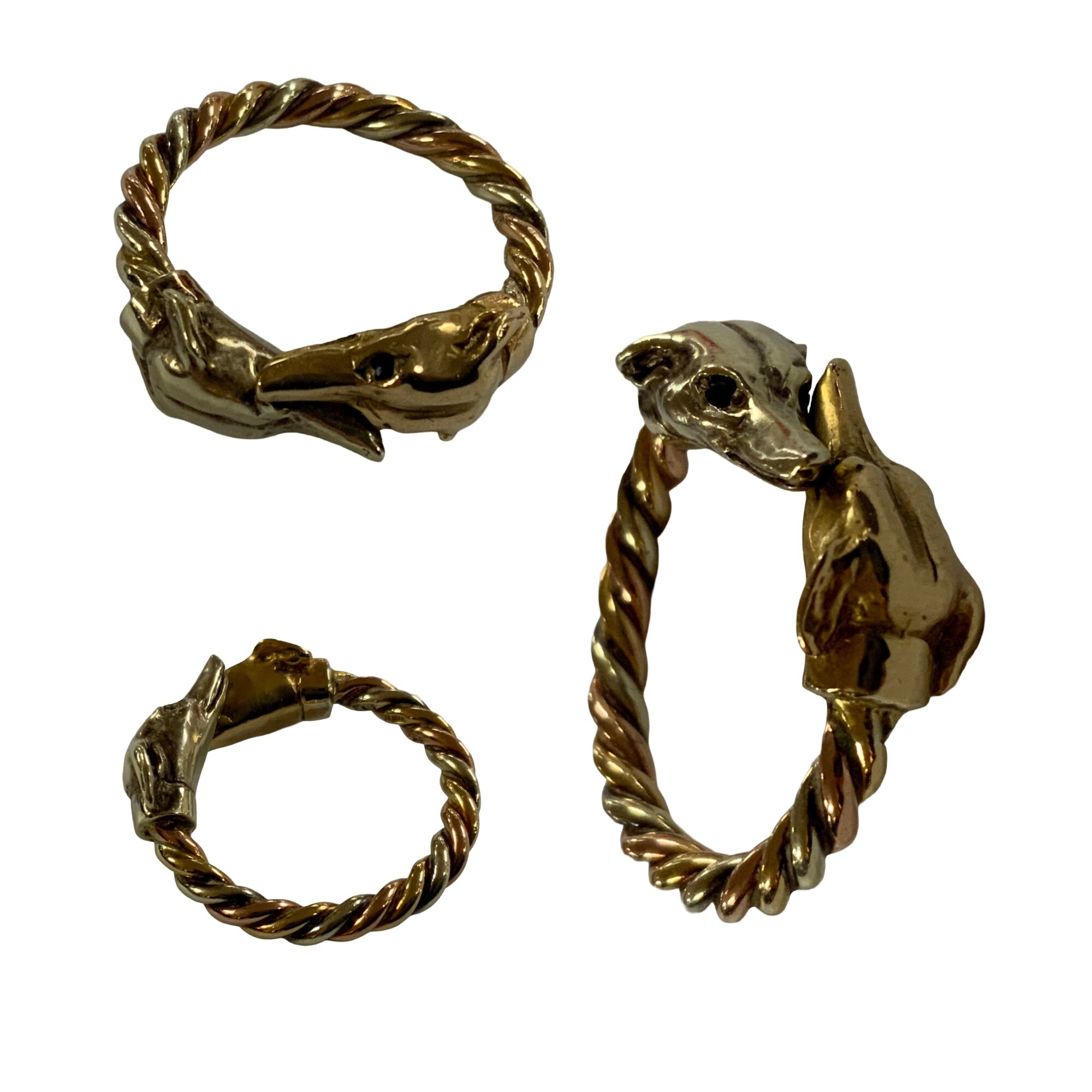 A Gents 9ct three tone gold Greyhound twist ring, size R. 10.6g total weight.