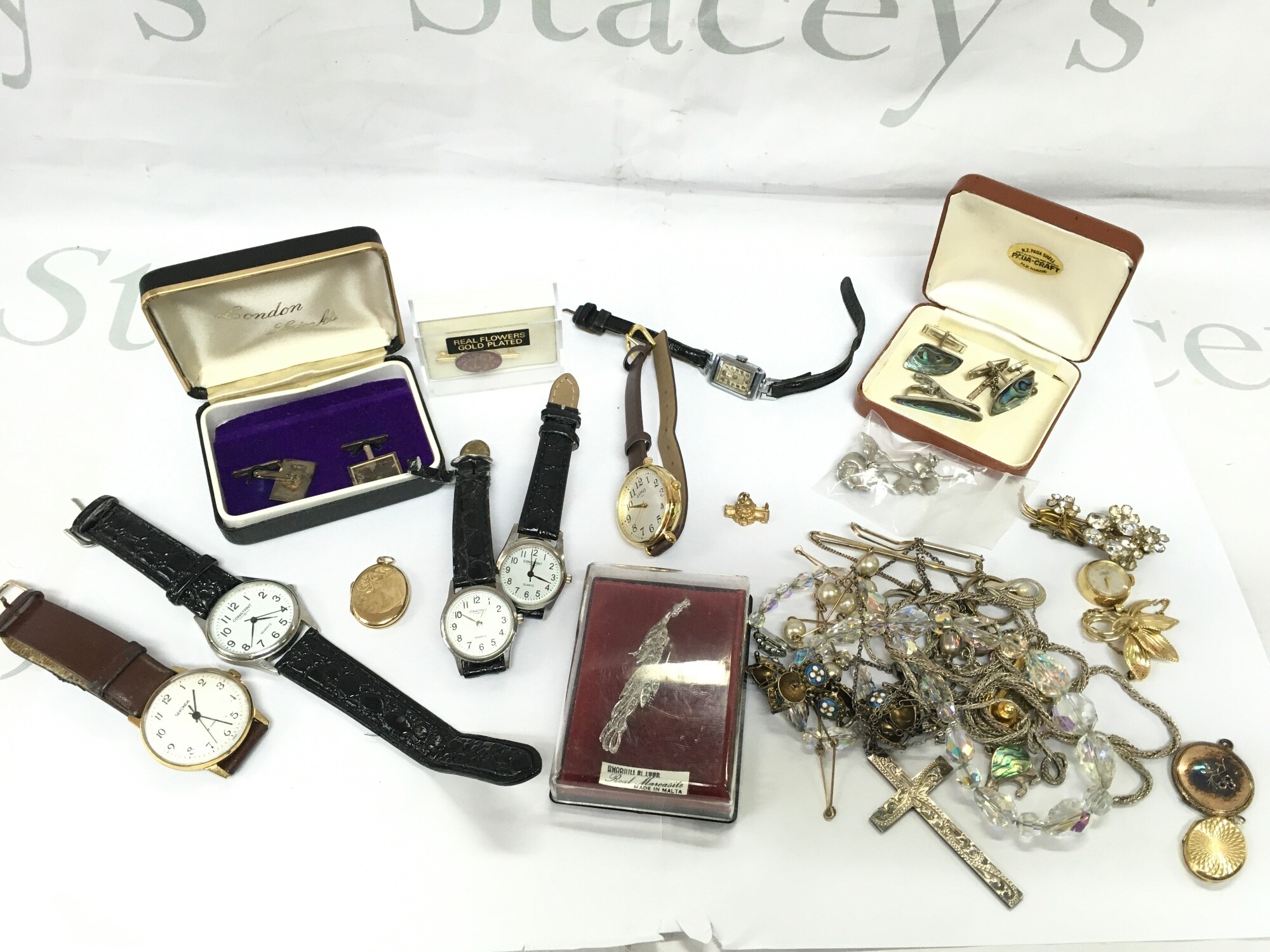Costume jewellery including silver hallmarked cufflinks, silver hallmarked cross pendant, 9ct gold charm St Pauls cathedral, watches, rolled gold etc.