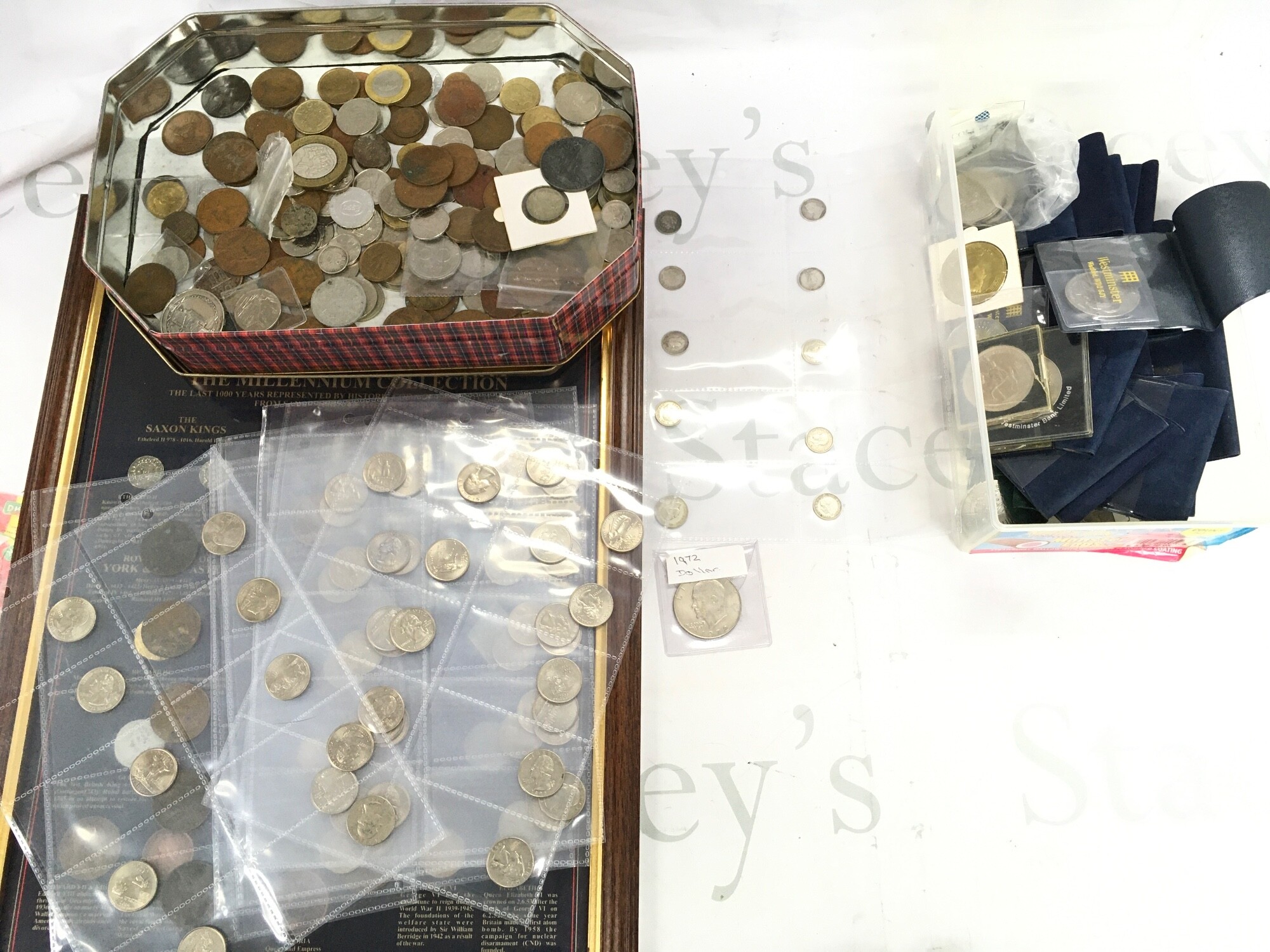 A collection of British and World coins including quarter dollars, a 1972 dollar, commemorative coins etc
