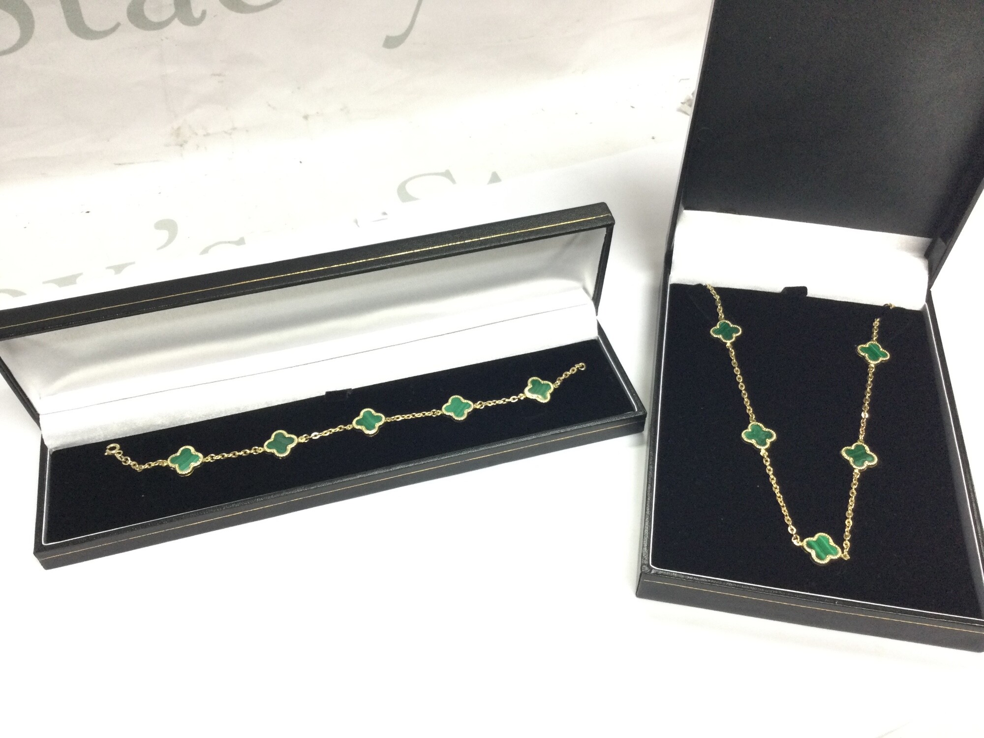 14ct Gold Green clover necklace (7.6g) and a matching bracelet (6.2g).
