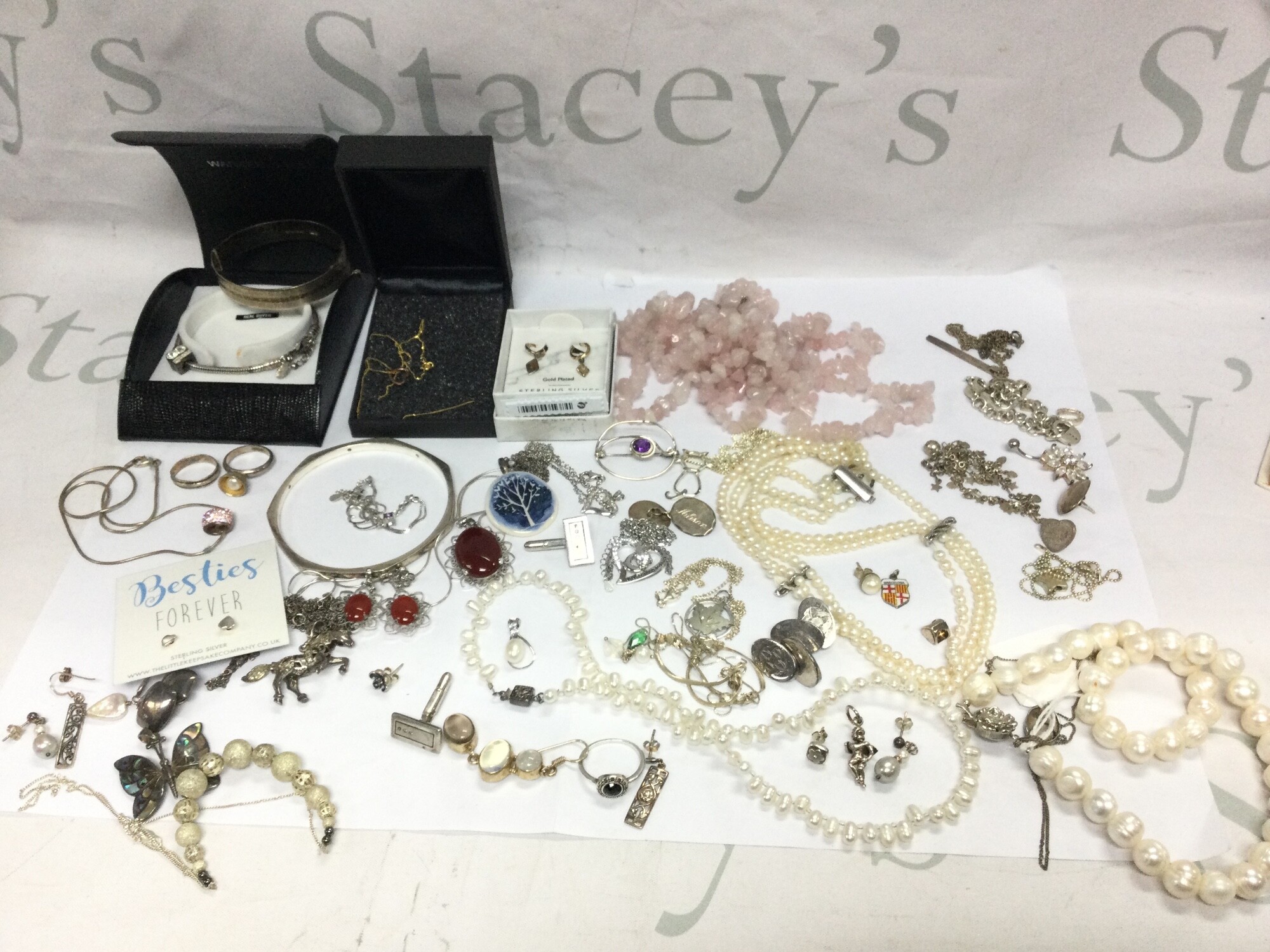 A collection of silver jewellery including bracelets, pendants, necklaces, rings