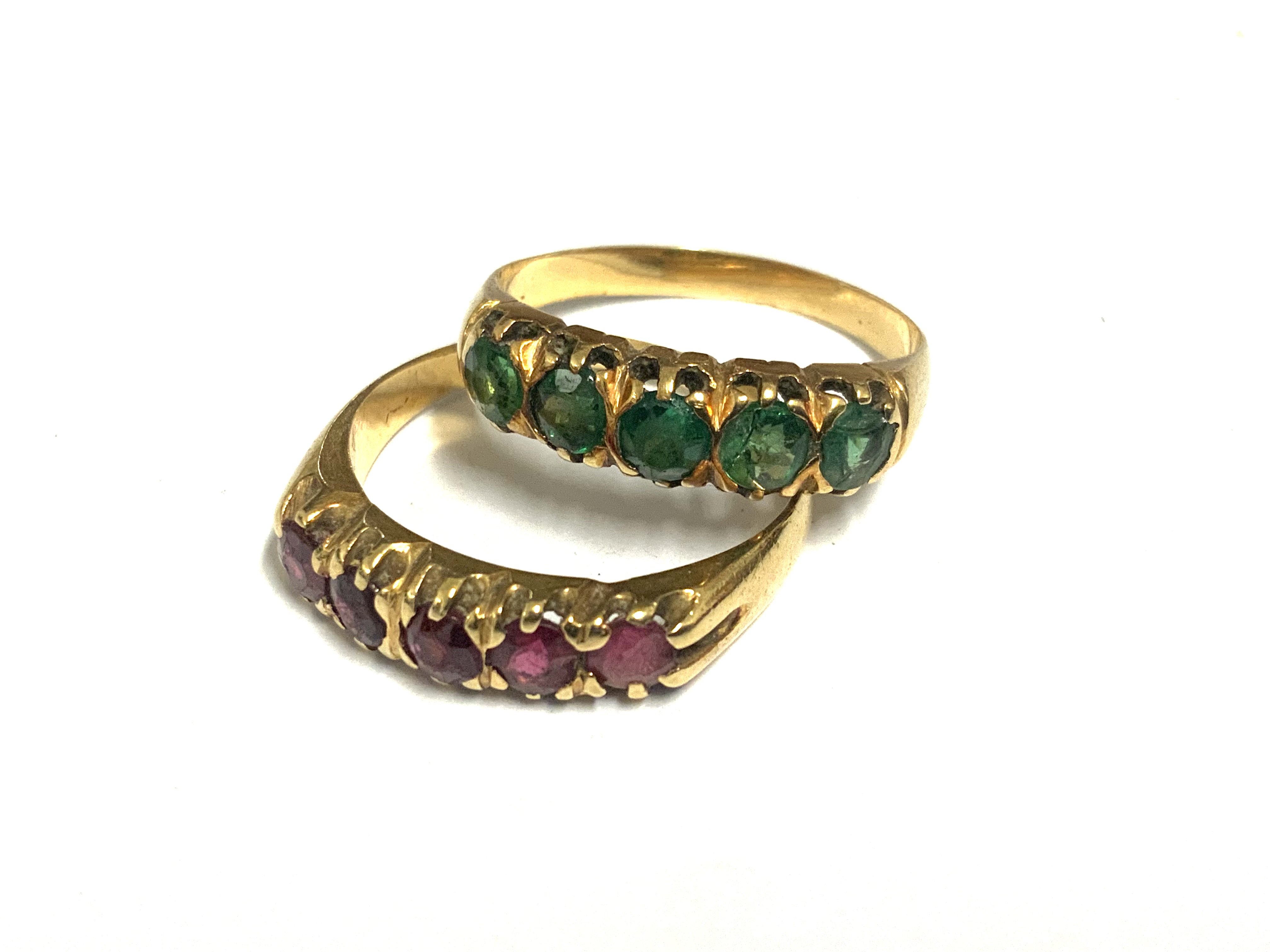 2 unmarked gold and stone set rings, both size P. 7.09g