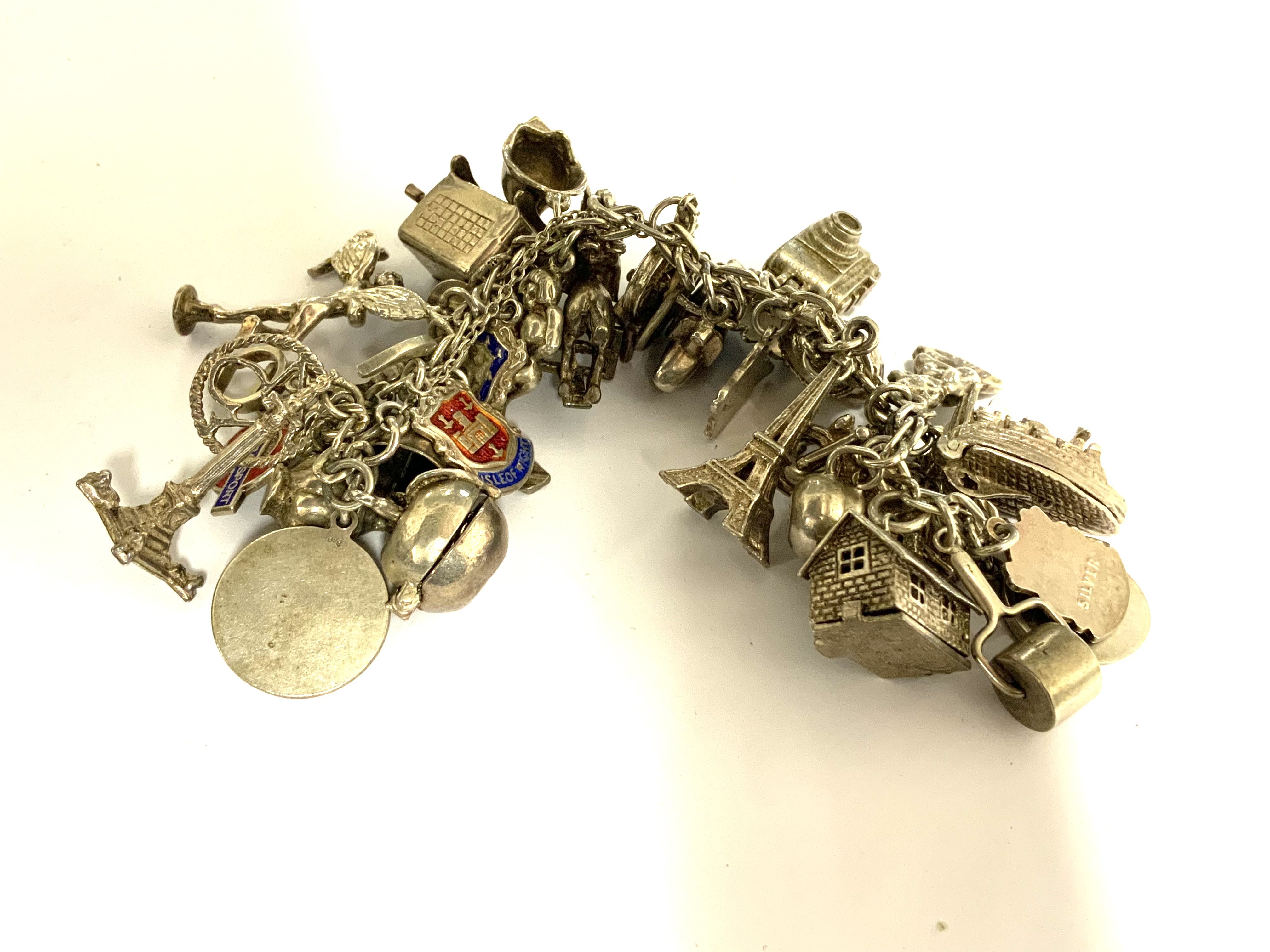 A heavy sterling silver charm bracelet. 
