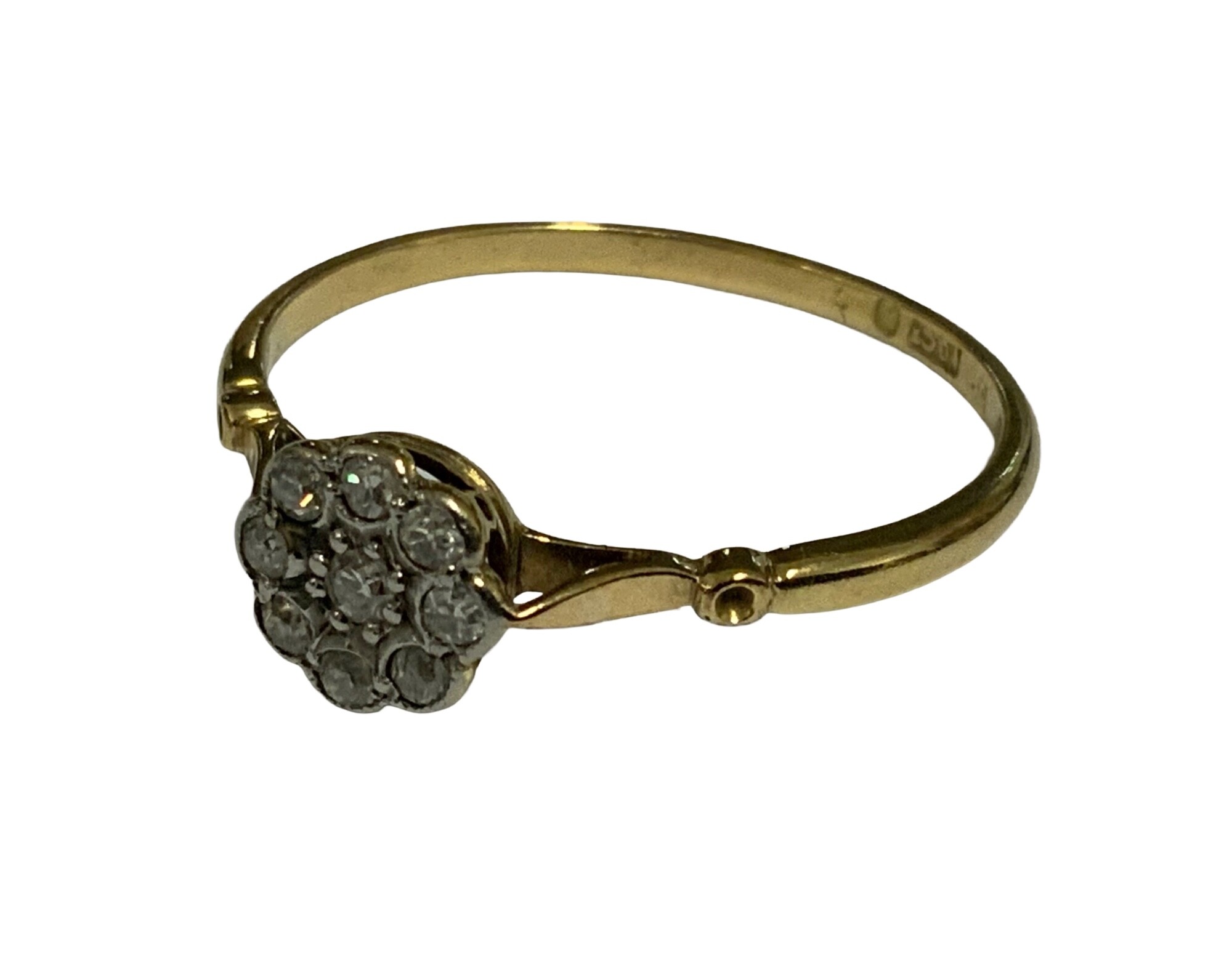 An 18ct yellow gold ring set with a pattern of diamonds. Size T.