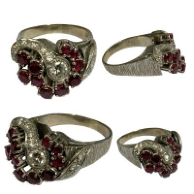 A 1970s heavy 18ct white gold ring set with 0.25ct diamond centre stone and surrounded with small diamonds and rubies. Size M, 8.7g.