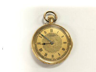An 18ct gold ladies button wind fob watch by J W Benson. Approximately 35mm and 28.88g