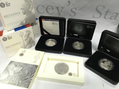 Four Boxed Royal Mint Britianna once ounce silver proof coins- 2010, 2014,2015 and 2017.
