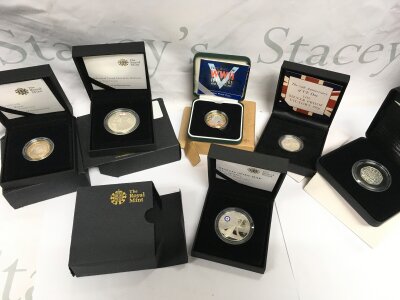A collection of Royal Mint coins including 2011 Mary Rose £2 silver proof coin, Admiral Nelson silver proof coin, End of WW2 60th anniversary £2 silver proof coin, 75th anniversary silver proof victory 50p, 75th anniversary of VE Day silver proof 50p, 100th anniversary Benjamin Britten 2013 50p silver proof coin, The Spirfire £5 silver proof coin
