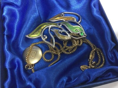 A Givenchy fish brooch and Givenchey pendant and chain