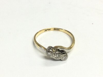 An 18ct gold and platinum 1930s triple set twist ring. Size N and 2.64g