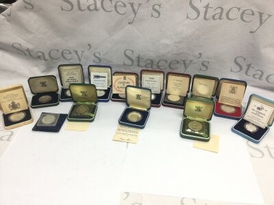 A collection of assorted silver and other coins and commemorative crowns.