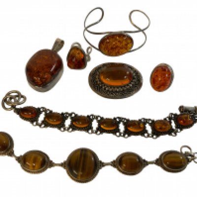 a mixed collection of sterling silver and amber jewellery including a tigers eye bracelet.