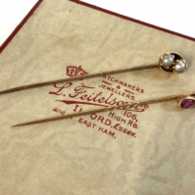 2 vintage gold stickpins, Diamond and Ruby example together with a pearl set example.