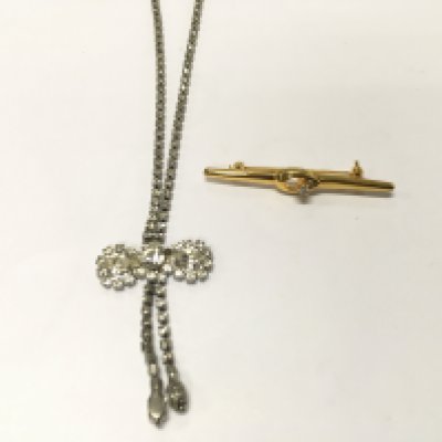 A costume jewellery brooch and necklace