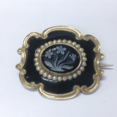 An unmarked gold brooch.