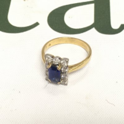 An 18ct diamond and sapphire ring Approx weight 4.19 grams, size O.