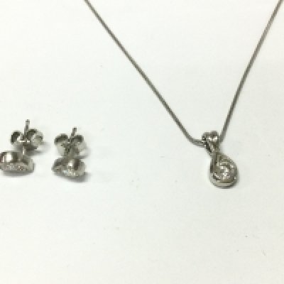 A platinum pendant set with diamond approx 0.and a pair of diamond earrings approx 0.71ct total.