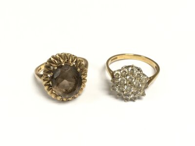 Two gold rings set with stones, approx sizes N and P and total approx 8.6g.