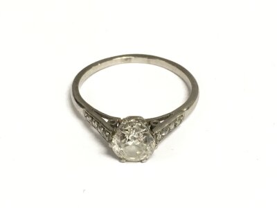 A white metal diamond solitaire ring, approx size O and approx 2.7g.