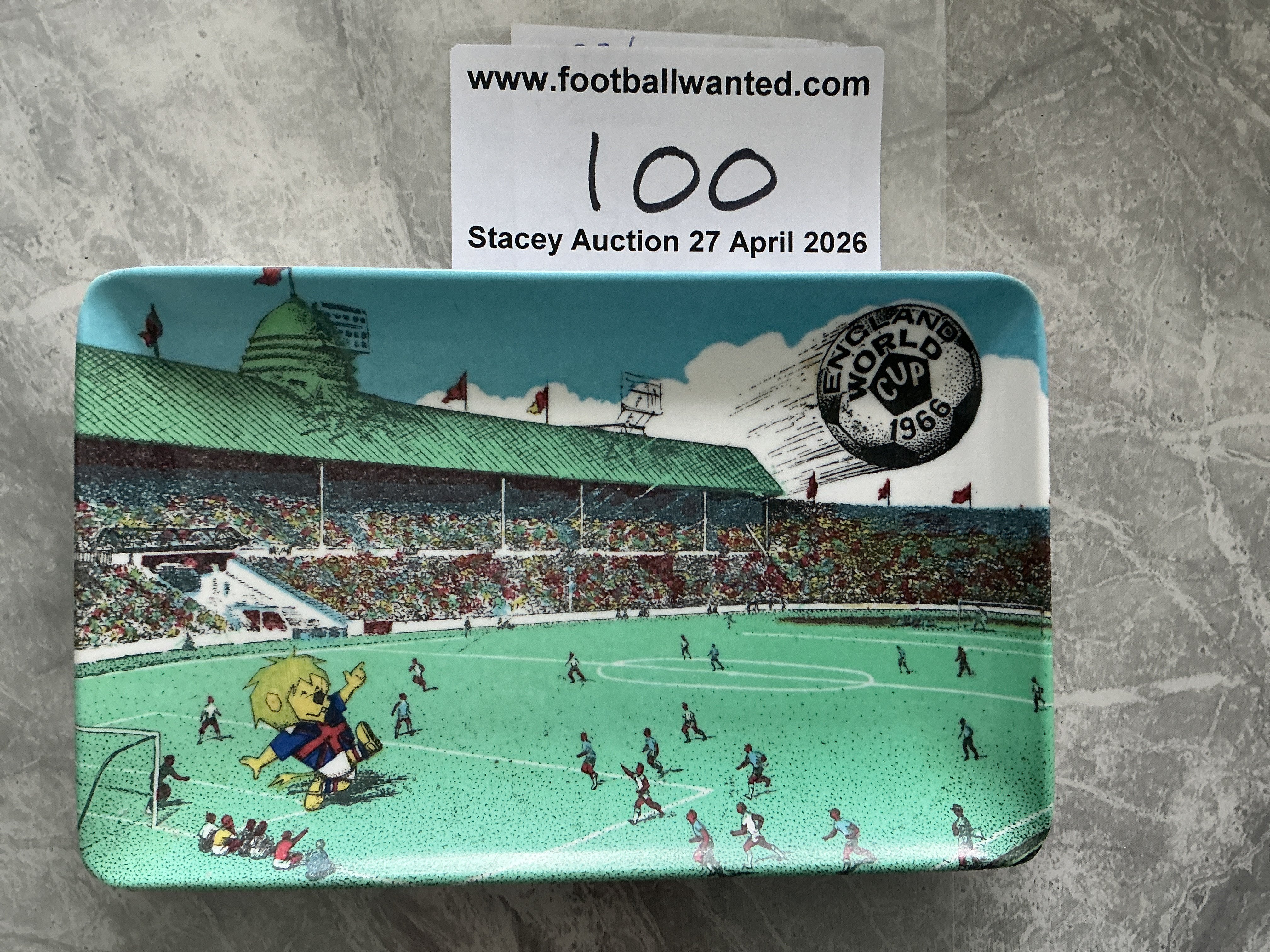 1966 World Cup Football Soap Dish: Just over 5 x 3 inches with a match scene from Wembley with World Cup Willie to one corner and the words England World Cup 1966 to the other. Plastic dish is in excellent condition. 