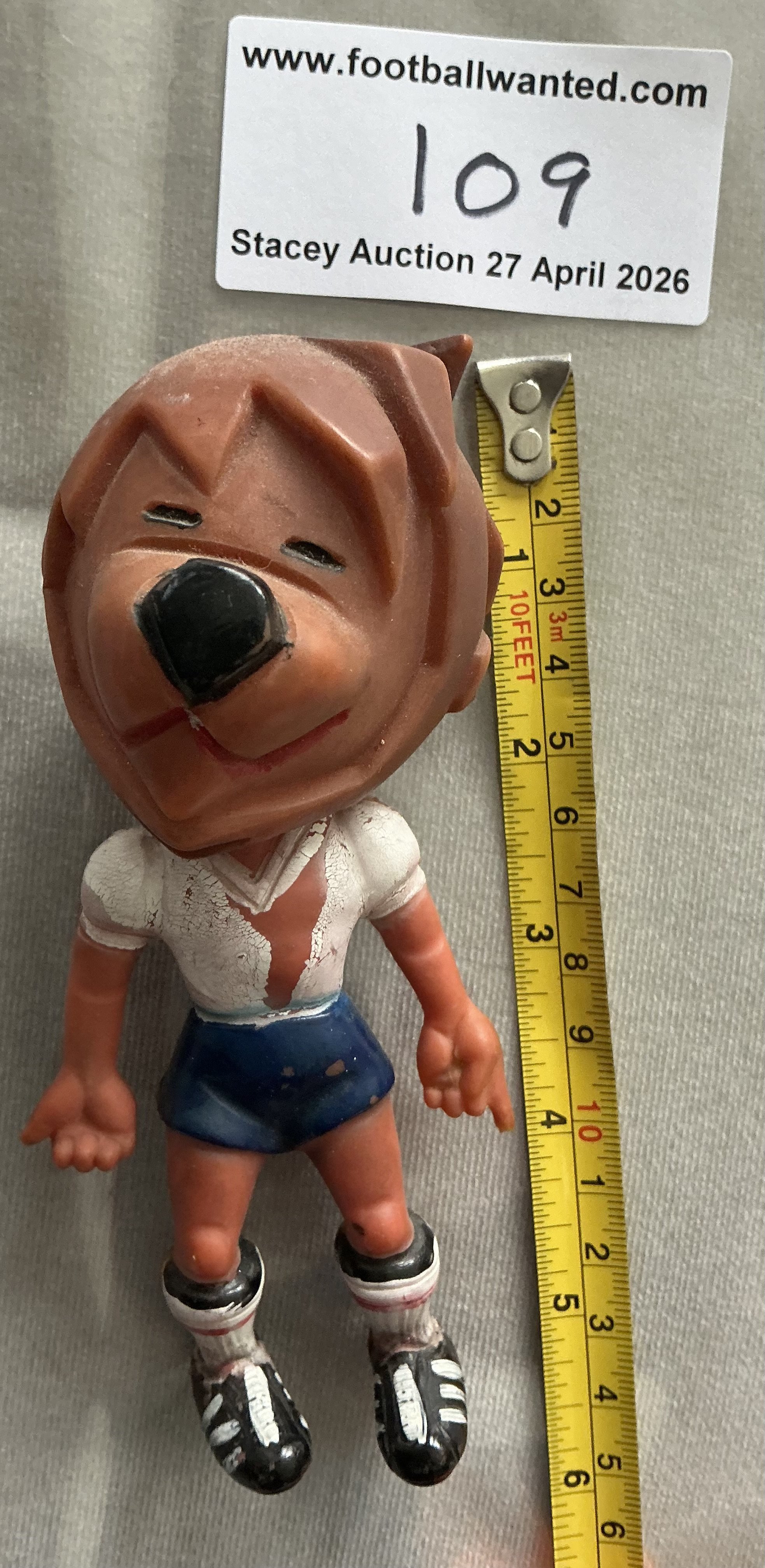 1966 World Cup Willie Football Figure: Plastic figure in England kit with Willie written to back of the shirt. Around 5 inches high with large lions head. FA copyright to rear. 