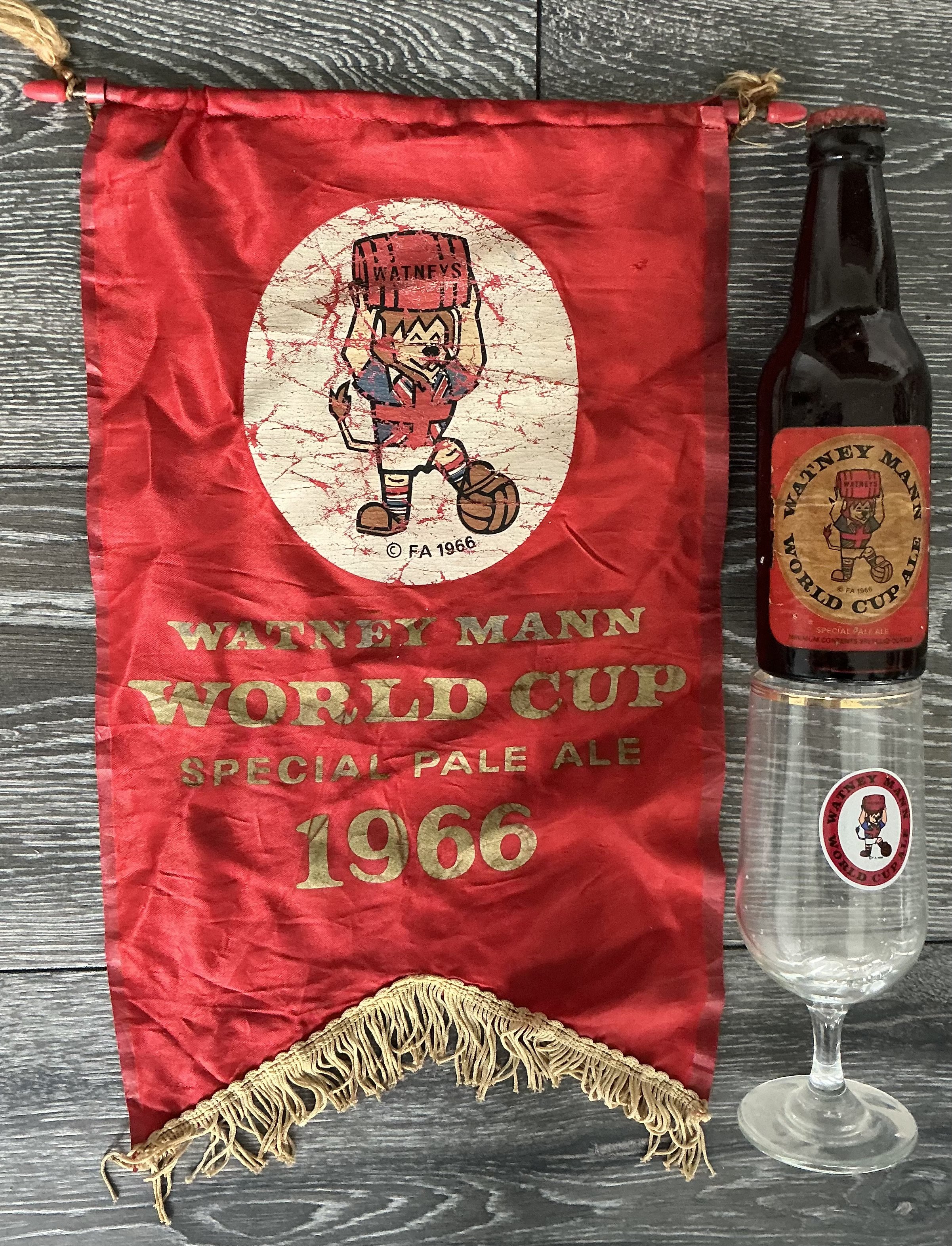 1966 World Cup Pale Ale Bottle Glass + Pennant: Would look stunning in a bar especially in the 60th anniversary. An original Watney Mann pennant, glass and incredibly an unopened bottle of Pale Ale all featuring WC Willie holding a barrel. (3)