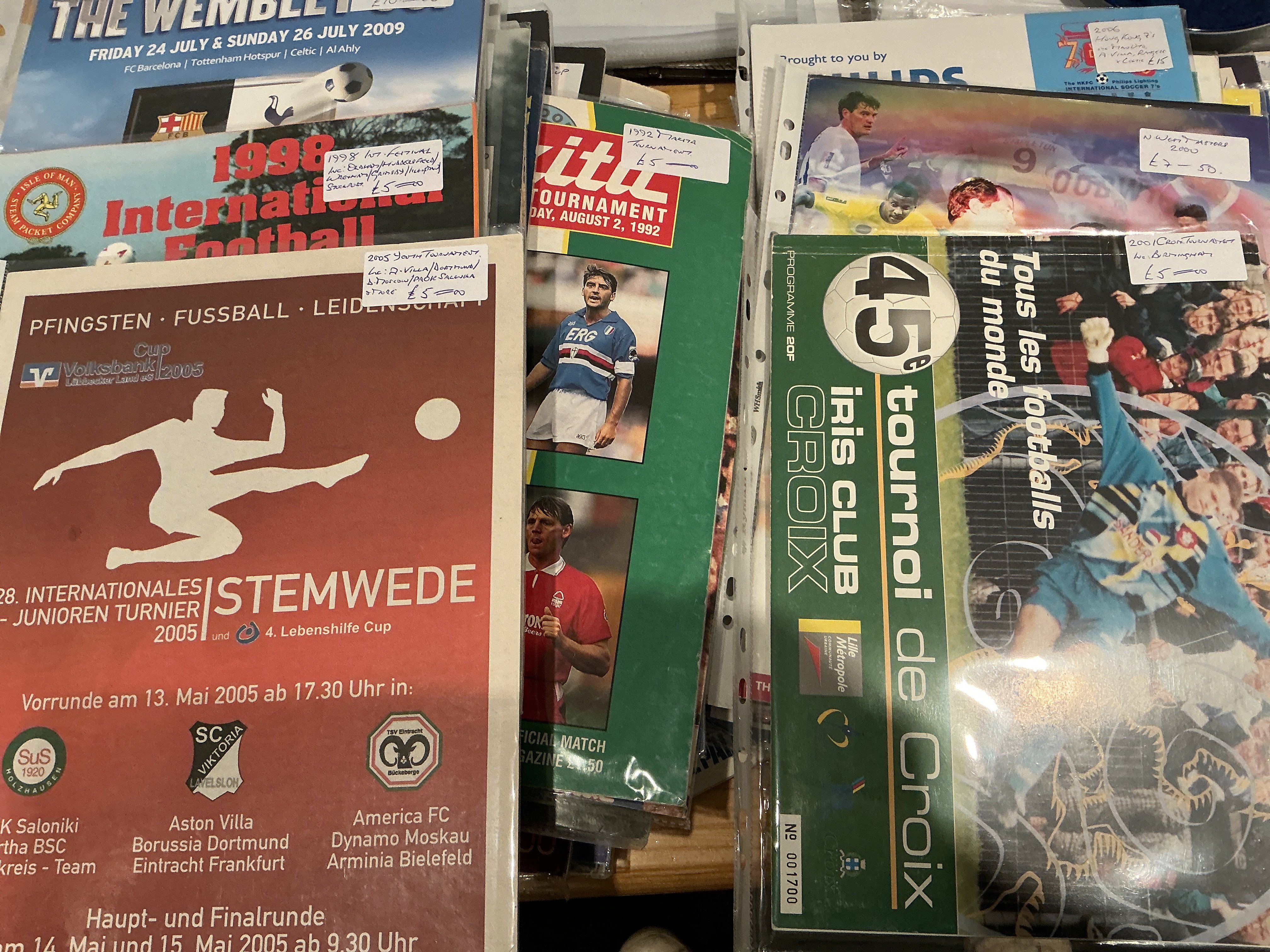 Tournament Football Programmes: Must view nearly all featuring British clubs with matches played in Dubai Germany Switzerland Holland Belgium USA and many more countries. Involves Manchester United Man City West Ham Arsenal Celtic Rangers and many more often pre season. Excellent with instructions to sell. (89)