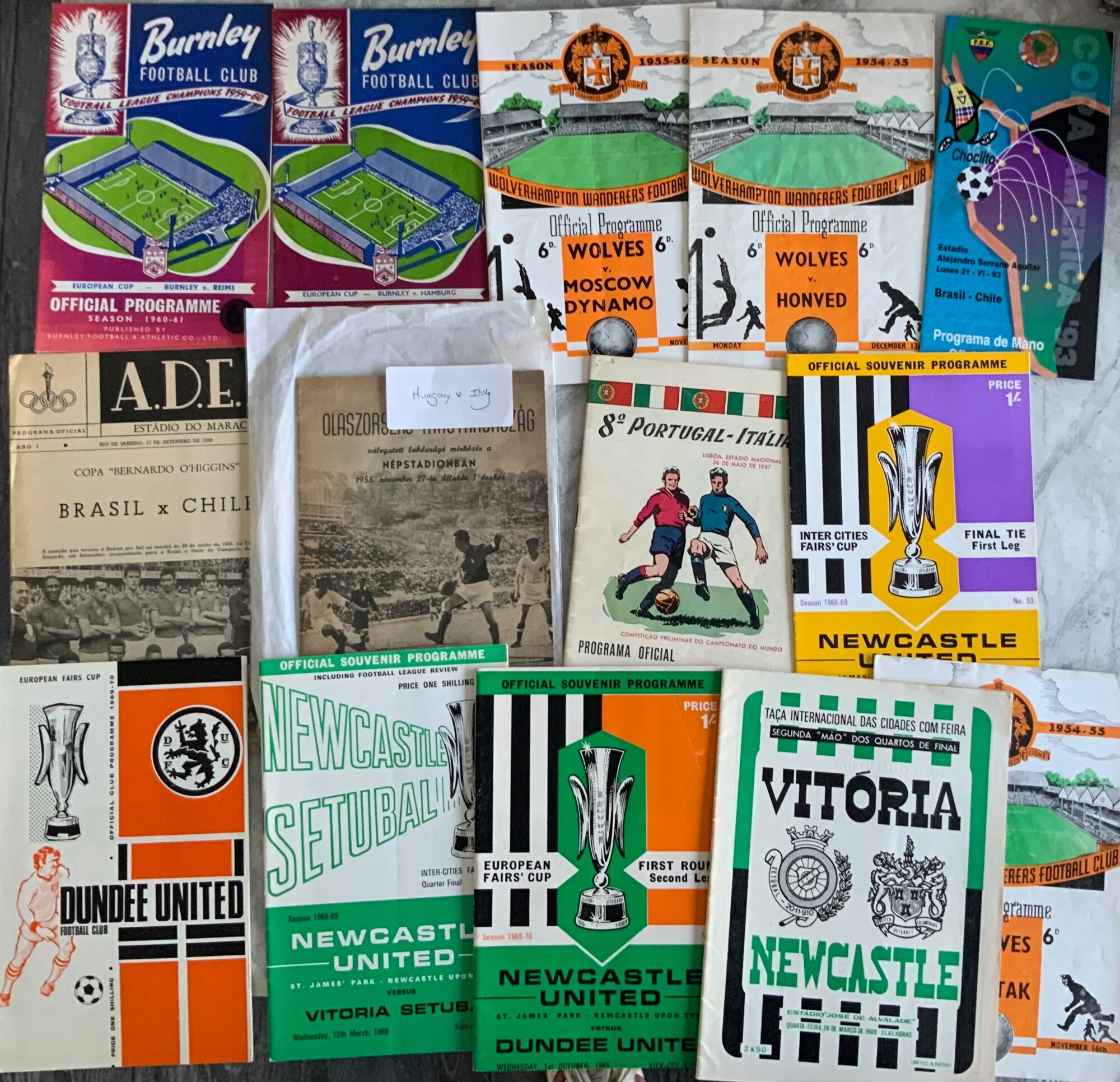 International + European Football Programmes: Includes 1955 Hungary v Italy, 1957 Portugal v Italy, 60/61 Burnley v Hamburg, Reims, 5 x Newcastle Fairs Cup with aways at Dundee Utd and Vitoria, 3 x Wolves mid 50s friendlies and more. Excellent. (14)