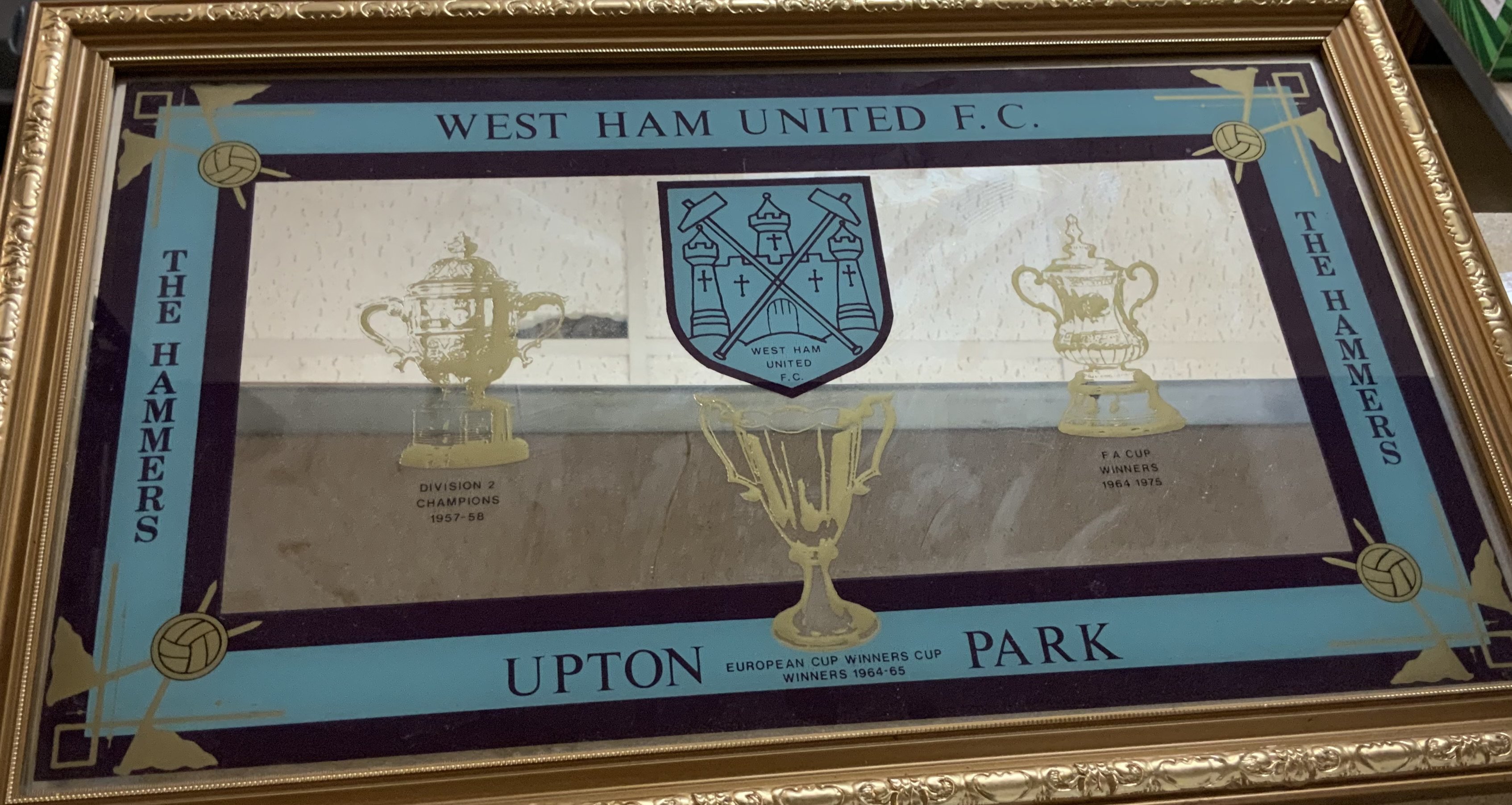 West Ham 1970s Football Mirror:  Measuring approximately 22x14 inches. Mirror details the FA cup wins of 1975 and 1964. ECWC 1965 and Division 2 champions 1958. 