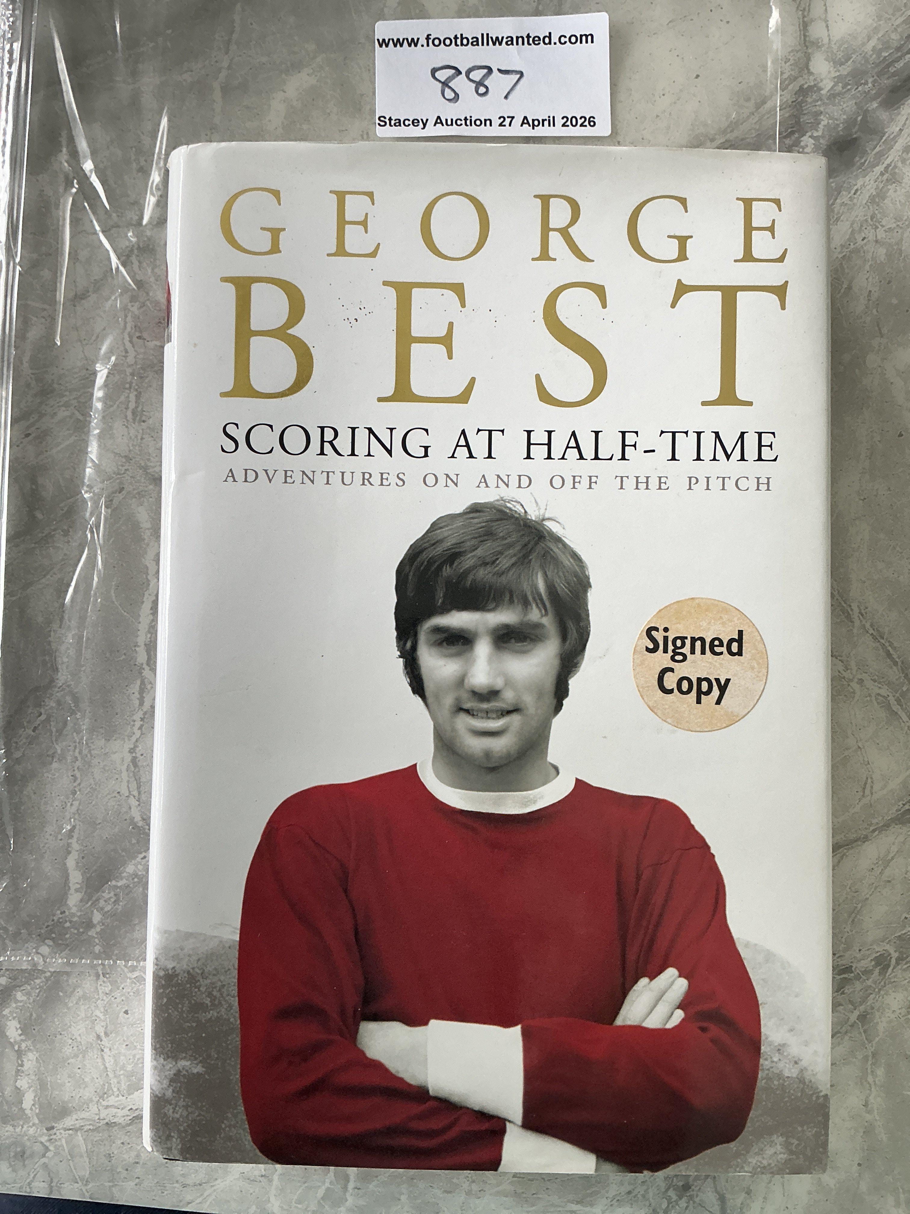 George Best Signed Manchester United Football Book: Scoring At Half Time hardback autobiography in excellent condition. Signed Copy sticker to front and clear undedicated autograph inside. 