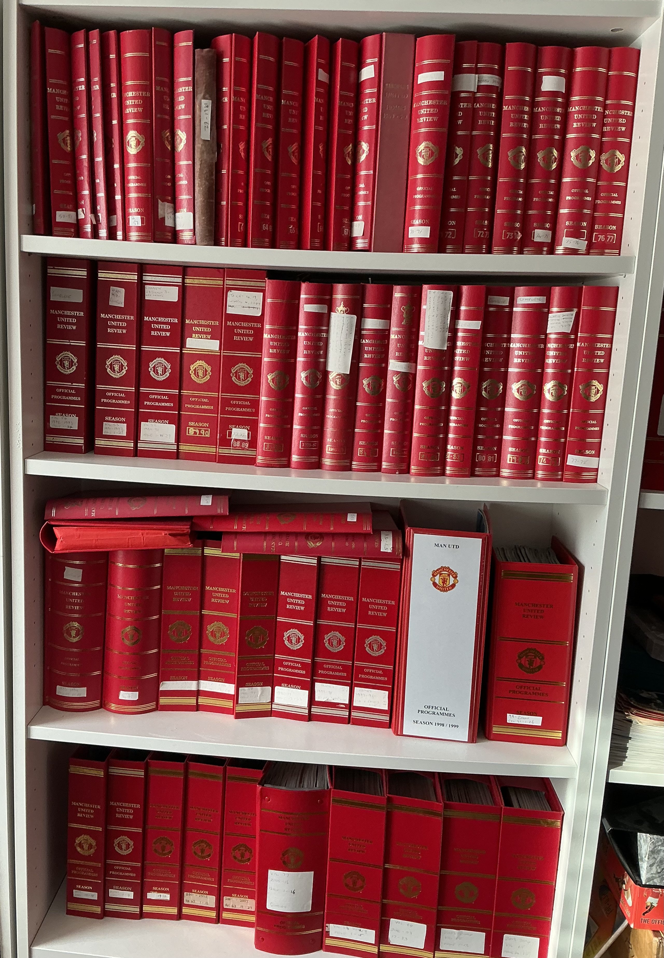 Manchester United Home Football Programme Collection In Binders: Stunning collection of official binders for seasons 49/50 through to 2016/17 in attractive red binders all with Manchester United and season in gold to spines. Including a few spares and a couple of black away binders there are 95 binders. Whilst this is from probate we feel this would be near complete of programmes from 57/58 to 2016/17 and going back to 49/50 there are around a further 30. 