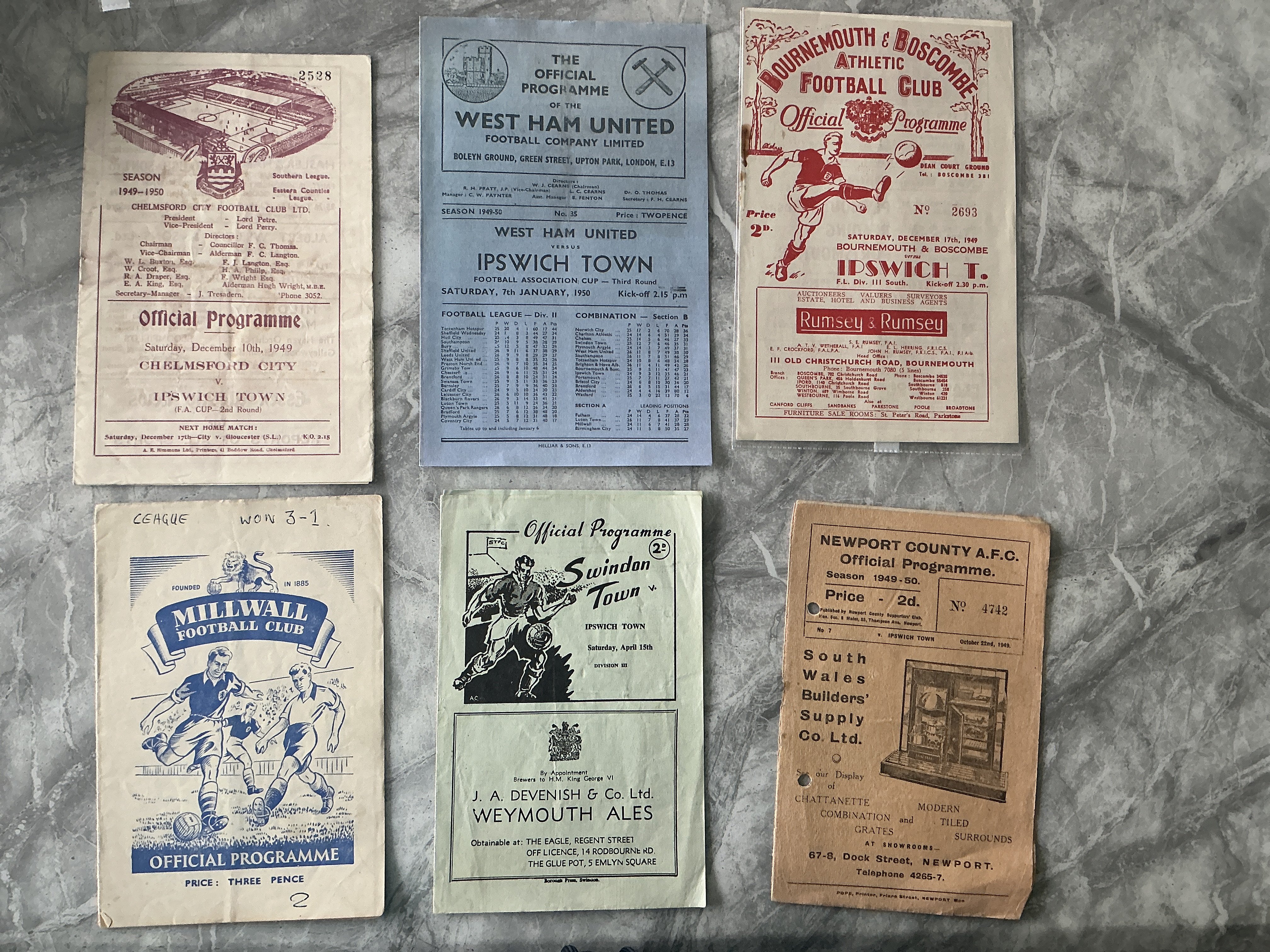 49/50 Ipswich Town Away Football Programmes: Bournemouth, Swindon, West Ham FA Cup all good, Chelmsford FA Cup has folding, Millwall has writing to cover and Newport has punch holes. (6)