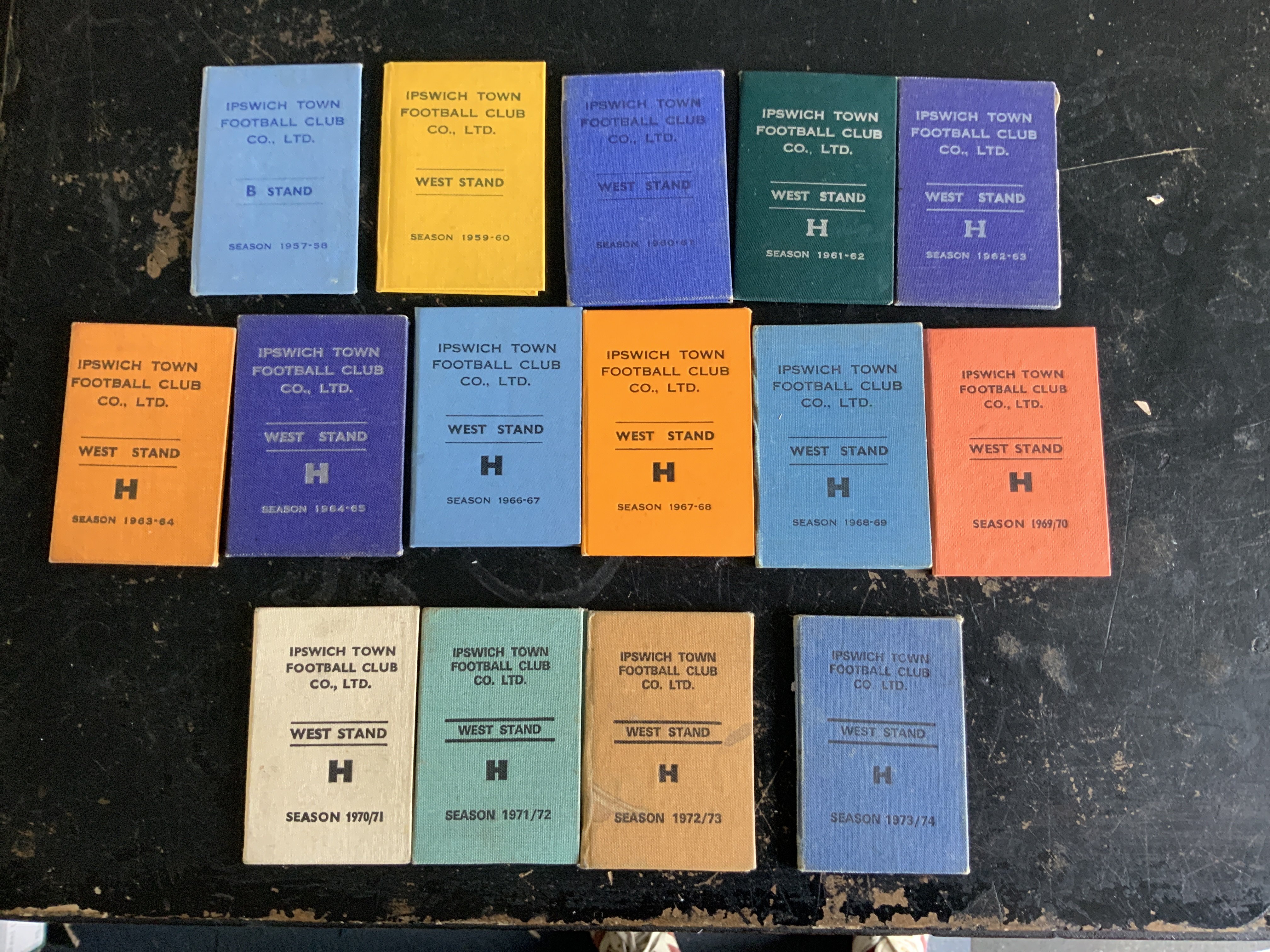 Ipswich Town Season Ticket Collection: Nice incomplete run from 57/58 to 73/74 which are all the same style hard cover small booklets which contain fixture lists and seat number. Very good. (15)