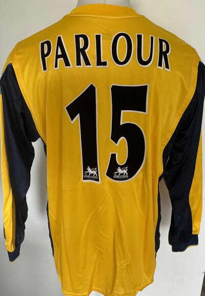 1999 - 2000 Arsenal Parlour Match Worn Football Shirt: Long sleeve yellow iconic Sega shirt with Premier League arm badging and number 15 Parlour to rear. Worn in match at Manchester United on 23 1 2000. COA from Parlour confirming this.
