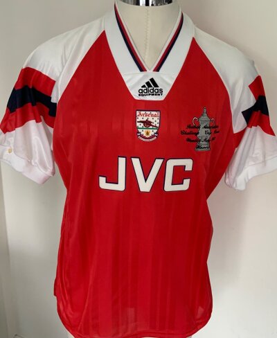 Arsenal 1993 FA Cup Final Winners Football Shirt: Good condition original shirt with FA Cup to breast and details of the win. Size 44 - 48 with a couple of marks.