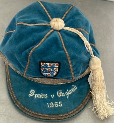 Nobby Stiles 1965 England International Football Cap: Given to the Manchester United legend for playing in the full international match v Spain on 8 12 1965. Excellent condition with Spain v England 1965 embroidered to peak beneath 3 Lions badge.
