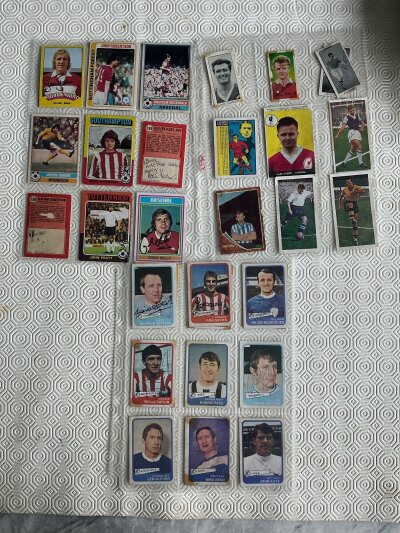 Signed Football Card Collection: From various sets to include Ron Davies Tommy Docherty Pat Rice Len Glover John Pratt and John Bond. Many have been previously stuck down. (38)