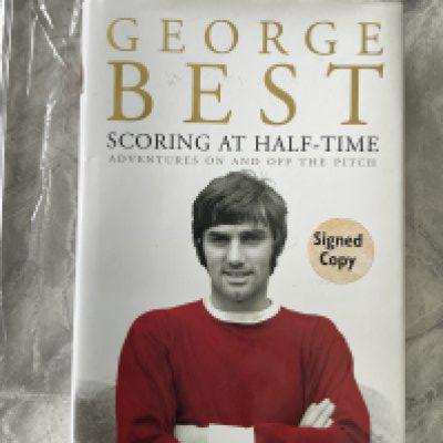 George Best Signed Manchester United Football Book: Scoring At Half Time hardback autobiography in excellent condition. Signed Copy sticker to front and clear undedicated autograph inside. 