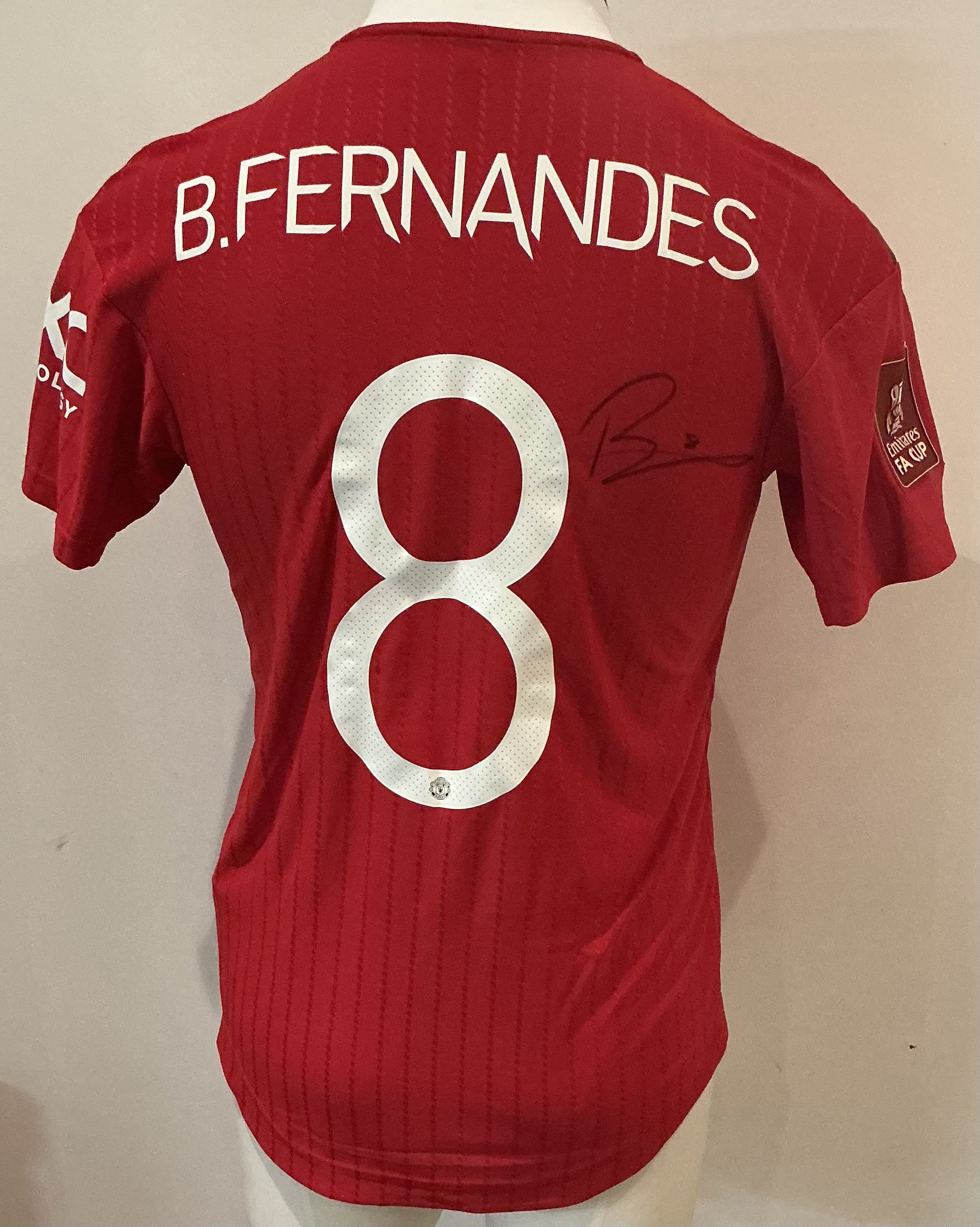 (Day Two 28 Oct 9am) Bruno Fernandes 2022 - 2023 Manchester United Match Worn Football Shirt: Red short sleeve number 8 with B.Fernandes to rear. Emirates FA Cup badging to sleeve. Swapped with Everton player after the match at Old Trafford. Signed to rear by Bruno. Manchester United went on to the final in this competition.