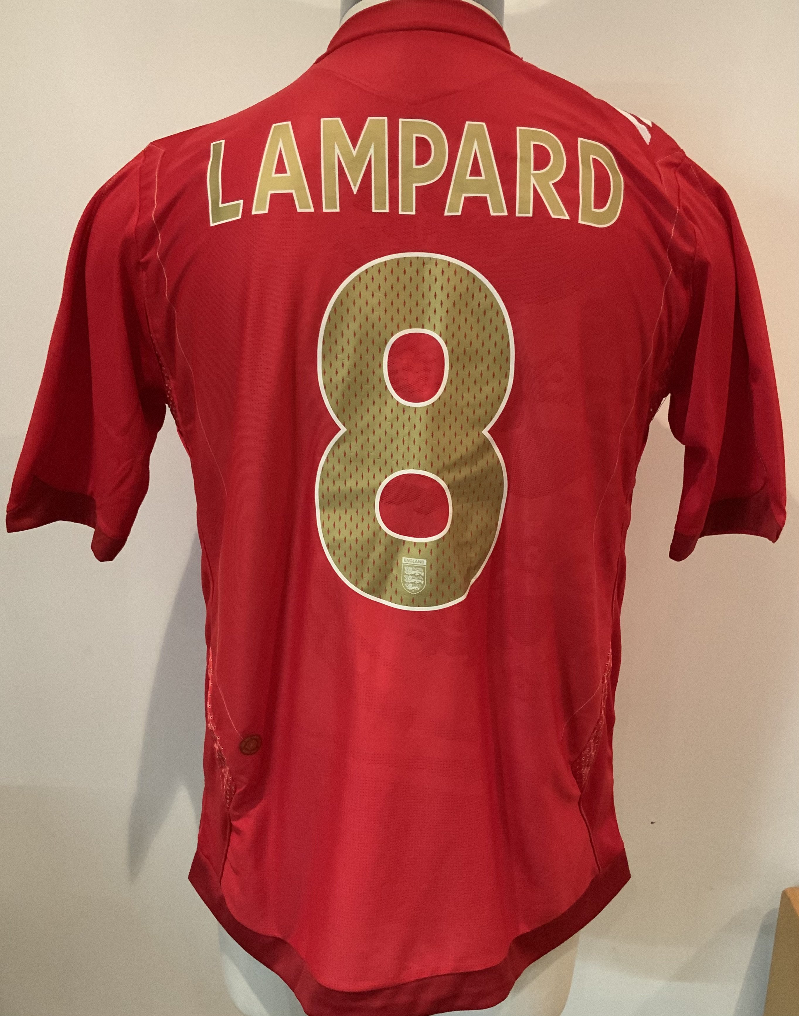 England Lampard 2006 Match Worn Red Football Shirt: Umbro short sleeve shirt with Lampard 8 to rear and no badging to sleeve as was a friendly. Number 8 to front with match details England v Greece 16 08 2006. Lampard scored in 4-0 win at Wembley. Direct from top source who we know.